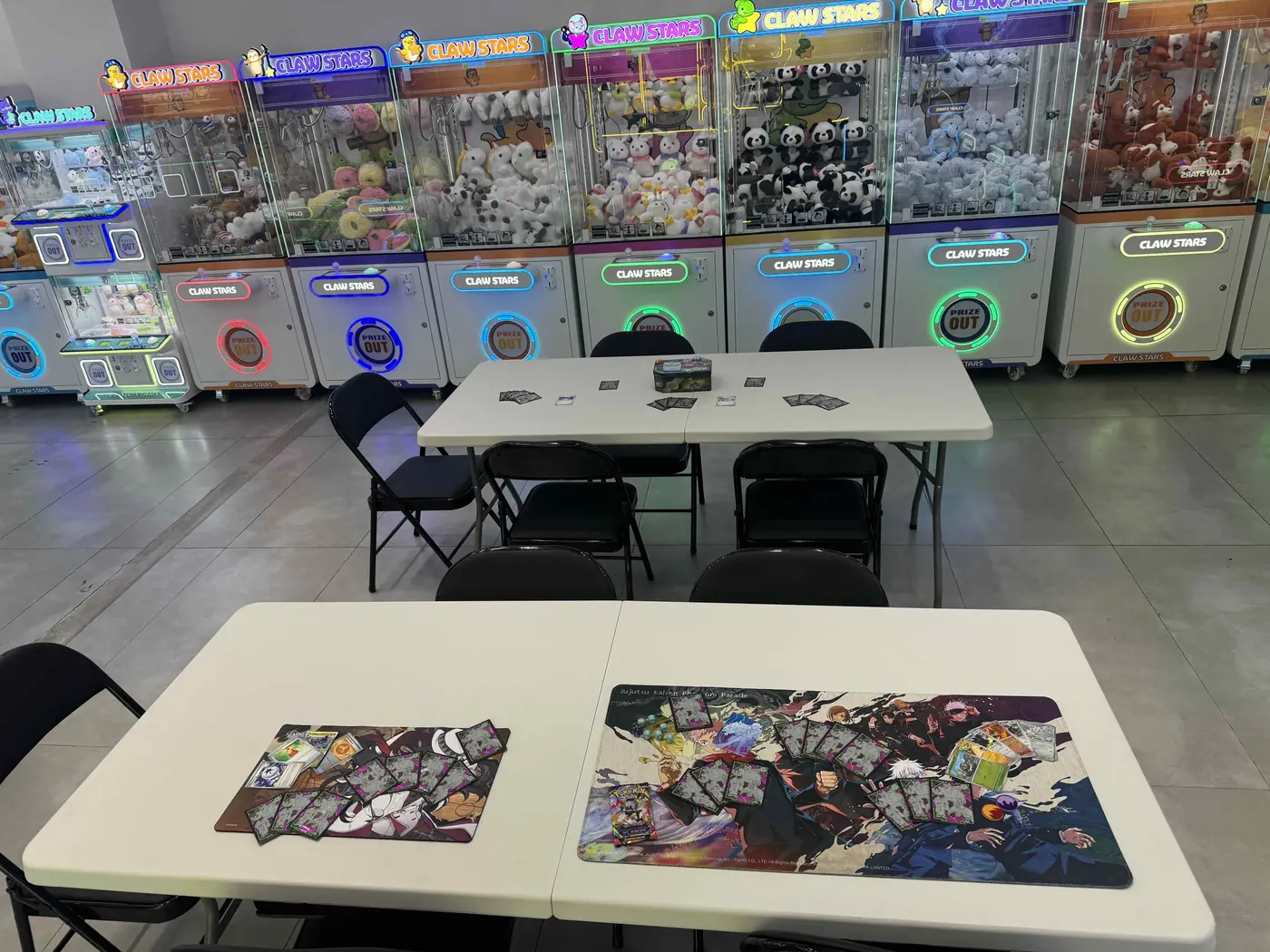 Play tables set up in the back of Claw Stars for Pokemon trading card games