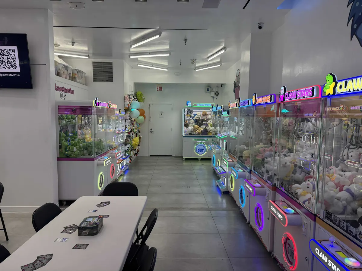 The Claw Stars floor, machines running down both sides of the aisle